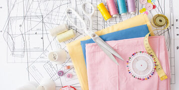 Sewing,Supplies,On,A,White,Wooden,Table:,Sewing,Thread,,Scissors,